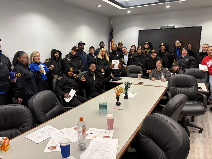 group of workers around a large table