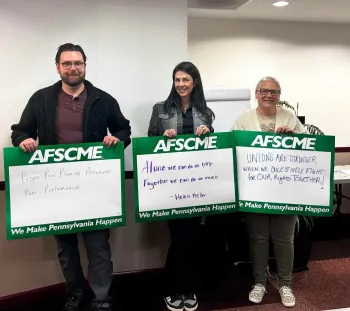 afscme members holding signs